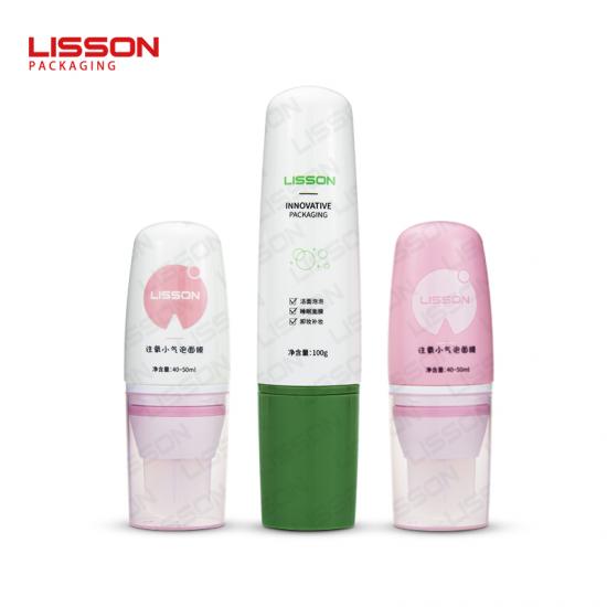 Tube cosmétique ovale avec tête de spatule en silicone