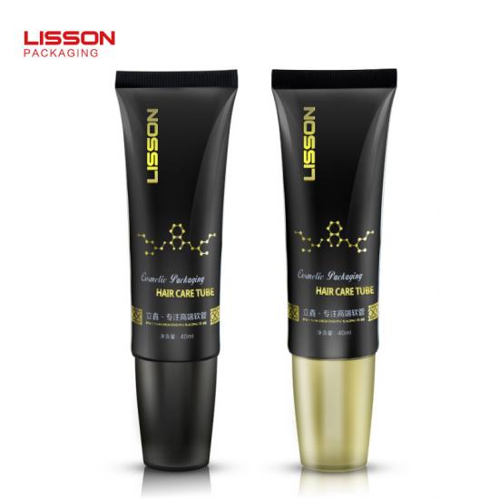 Tube en plastique pour soins capillaires avec applicateur brosse de massage